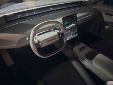 Skoda Skoda Vision O interieur, modern beige stuurwiel, digitale displays en dashboard.
