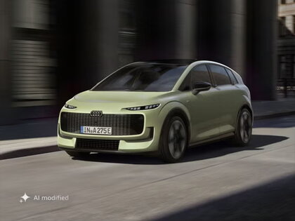 Een rijdend frontaal shot van een lichtgroene Audi A2 e-tron