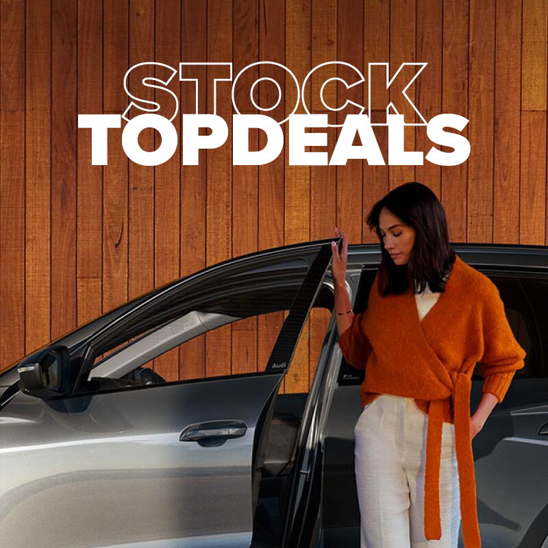 Groep Thoen Stock Topdeals vrouw met oranje shirt opent deur