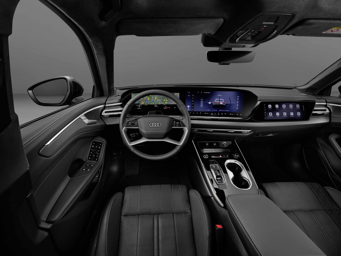 Breedbeeld interieur van de Audi A6 Allroad, voorzien van geavanceerde displays en een opgeruimde middenconsole.