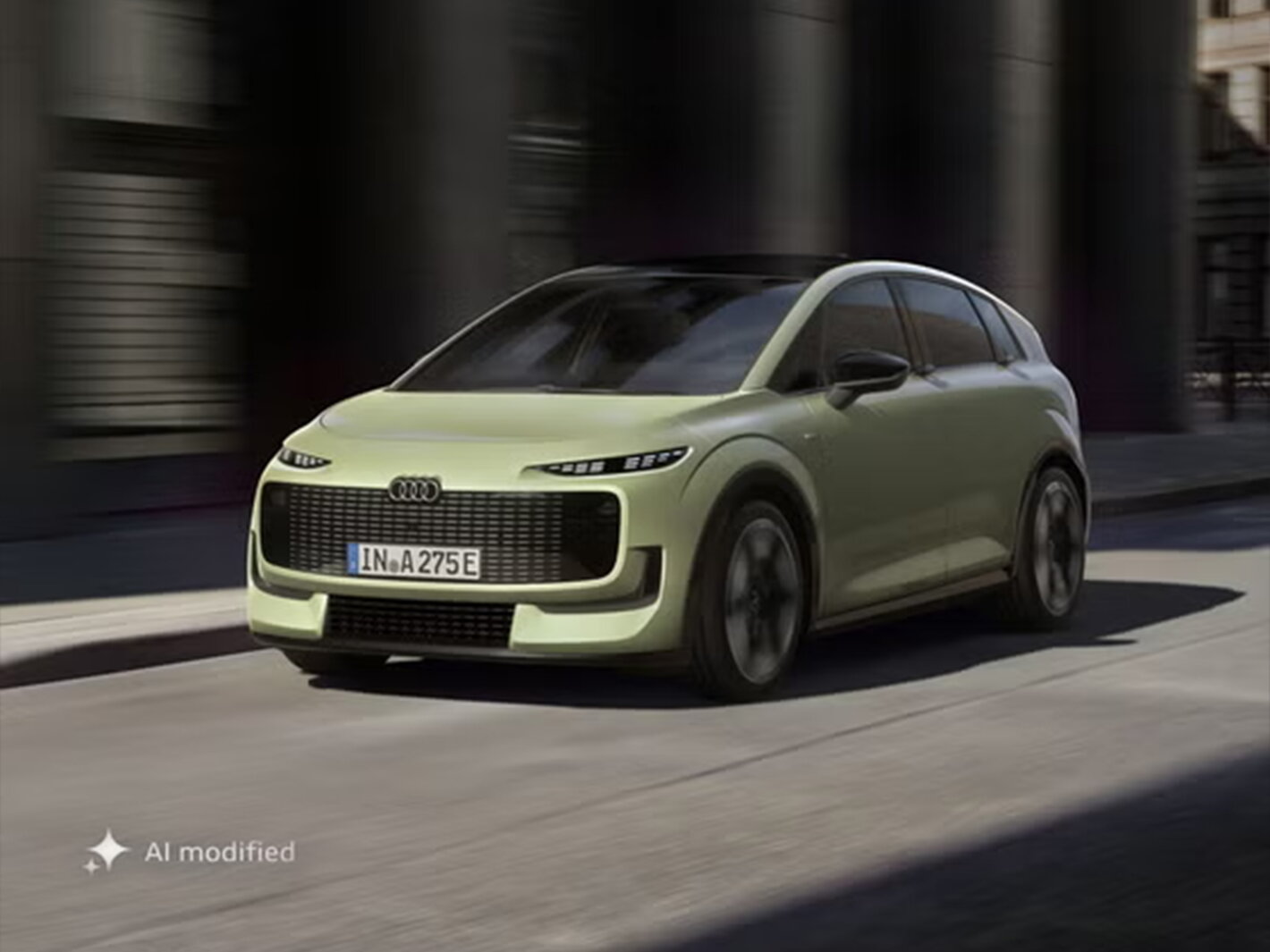 Een rijdend frontaal shot van een lichtgroene Audi A2 e-tron
